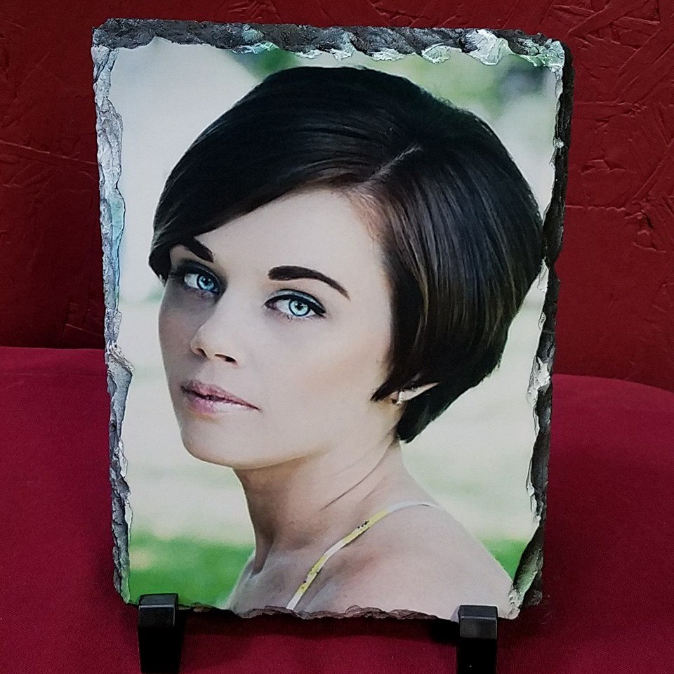A professional photo of our niece (used with permission) on a rectangle slate.  This turned out