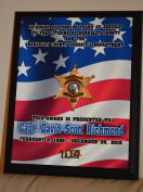 Service award using art as well as the honoree's own badge and unit number which were affixed t