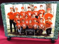 This is a vintage Little League team slate with a shot of the team from 1985.