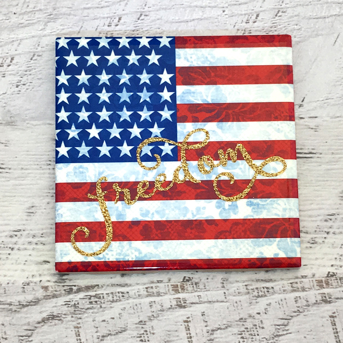 US Flag on a tile with the word Freedom in HTV glitter